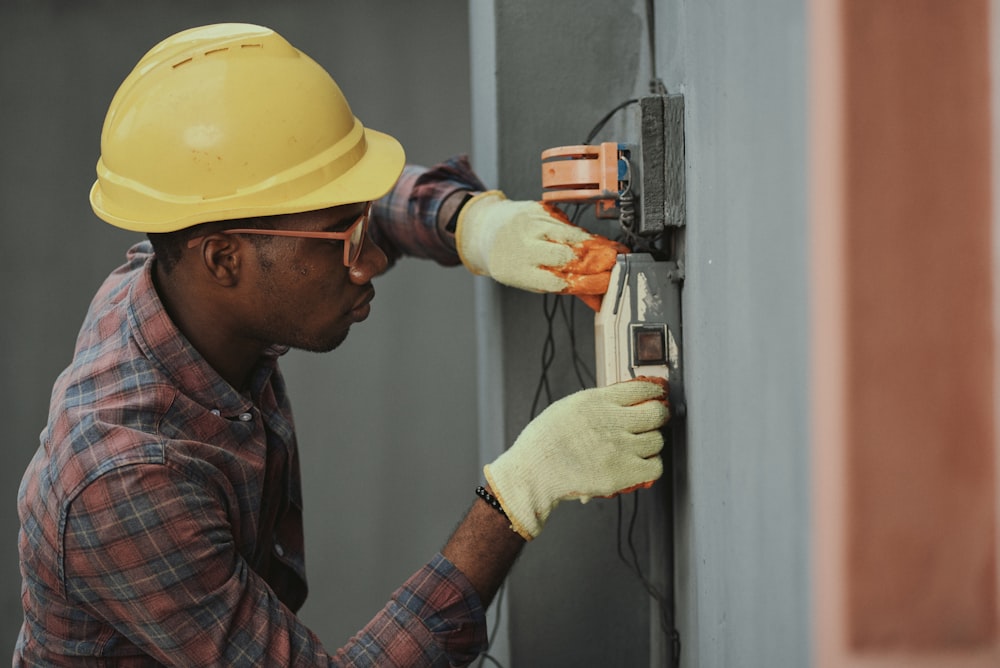 Licensed plumber repairing a pipe